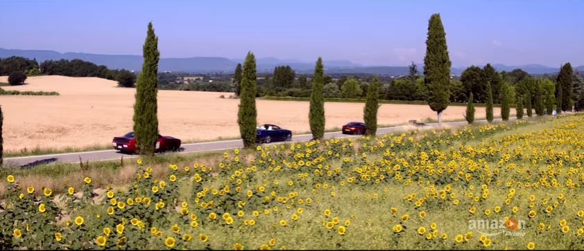 Cars and picturesque locations are both heavily featured