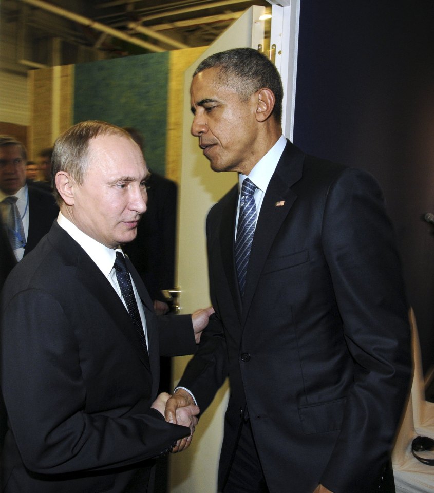 Russian President Vladimir Putin shakes hands with U.S. President Barack Obama as they attend the World Climate Change Conference 2015 (COP21) at Le Bourget, near Paris