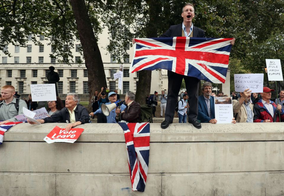 Pro-Brexit campaigners protest alongside pro-Europe protesters as they take part in a March for Europe rally in September