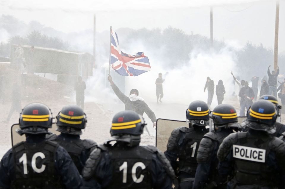 Tear gas fills the air as French riot police face off with demonstrators 