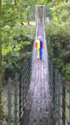 The chilling figure breaks into a run after the cameraman points out that he's holding a knife