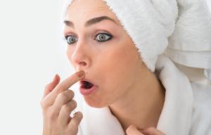 Don't panic but squeezing your spots could cause blindness and may even kill you
