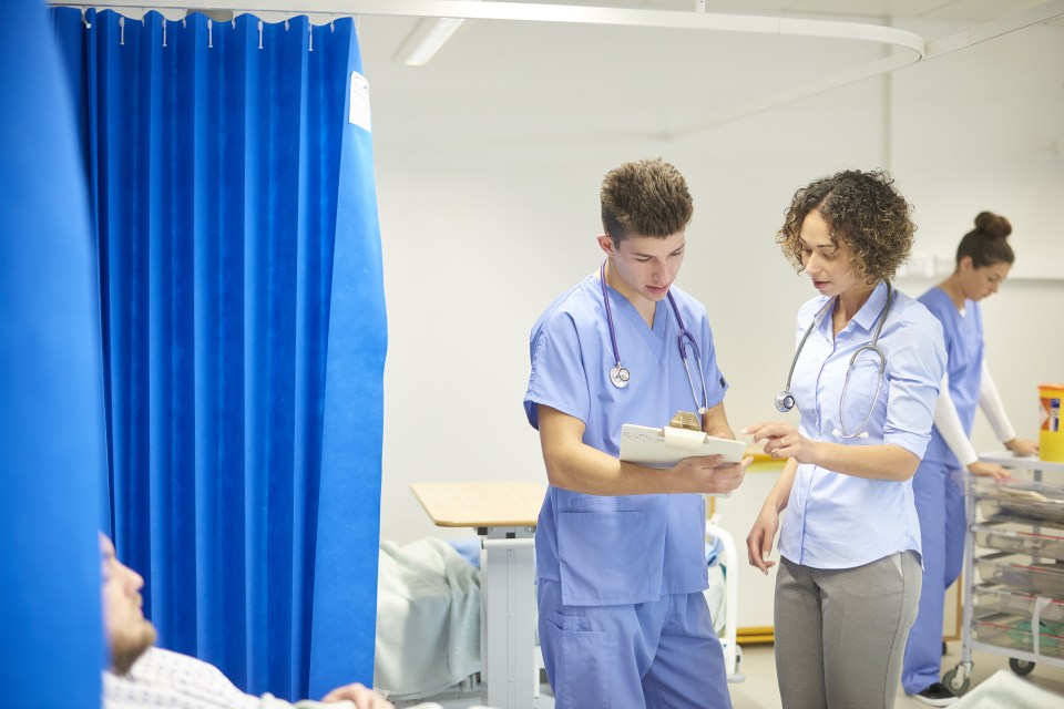 Doctors on a busy hospital ward