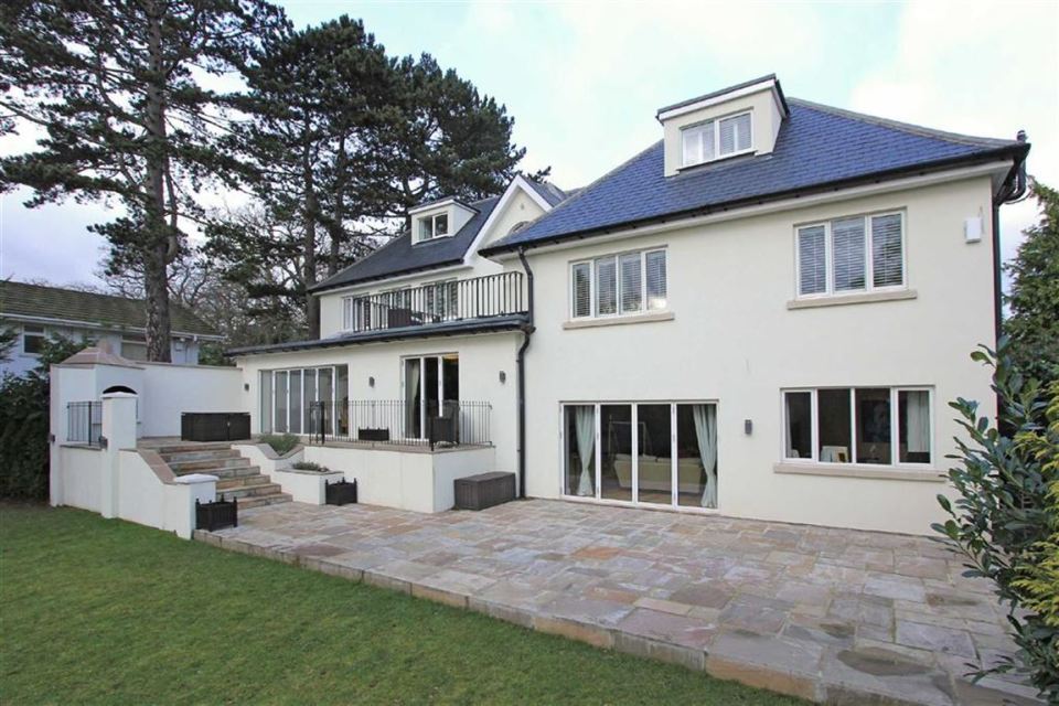 The rear of the house has a huge garden for the group to fool about in 