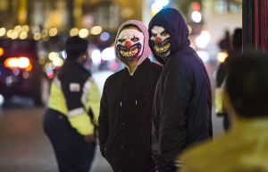 Cops hunting pranksters dressing up as clowns and jumping out from behind bushes at kids mimic US craze