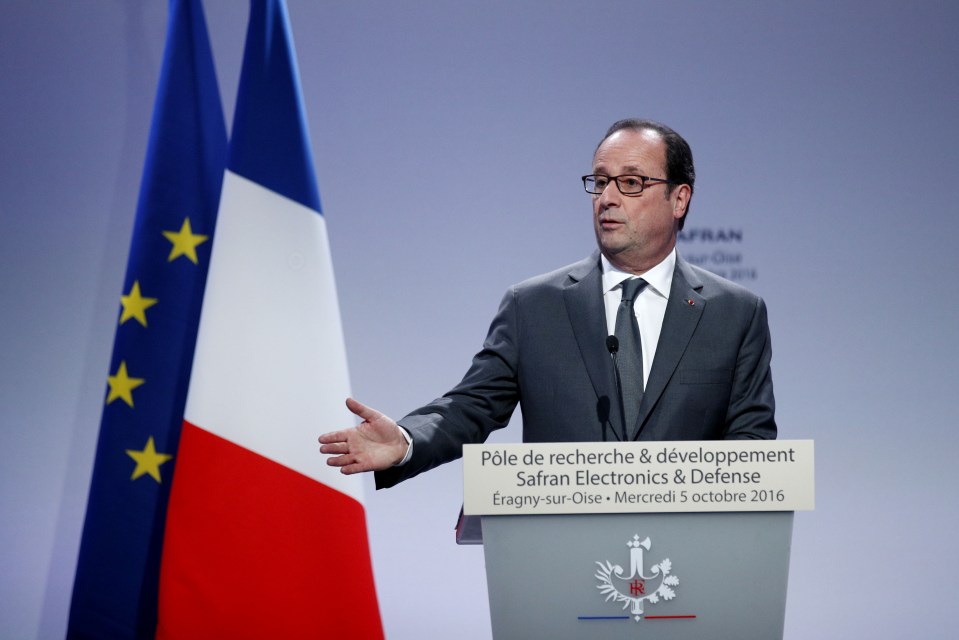 French President Francois Hollande gives