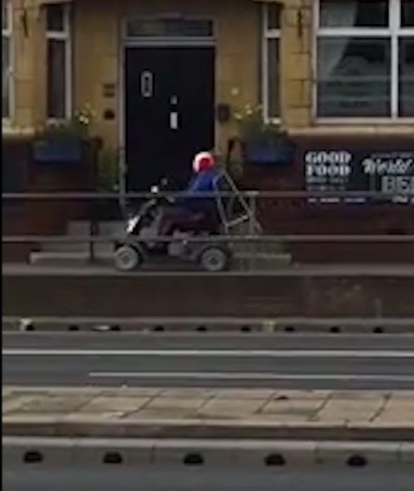 The clown riding a mobility scooter shot past a car salesroom in Sheffield