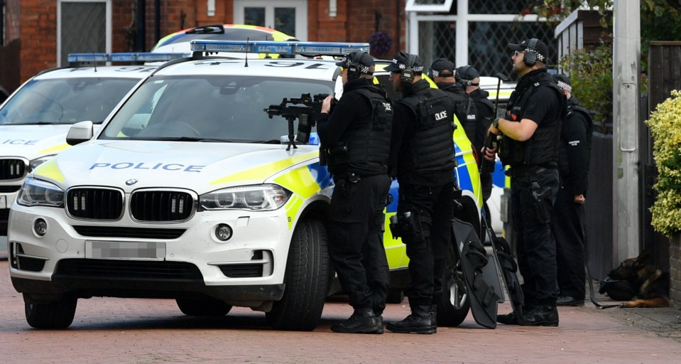 Dramatic pictures showed armed officers taking aim as they surrounded a property in Grimsby today
