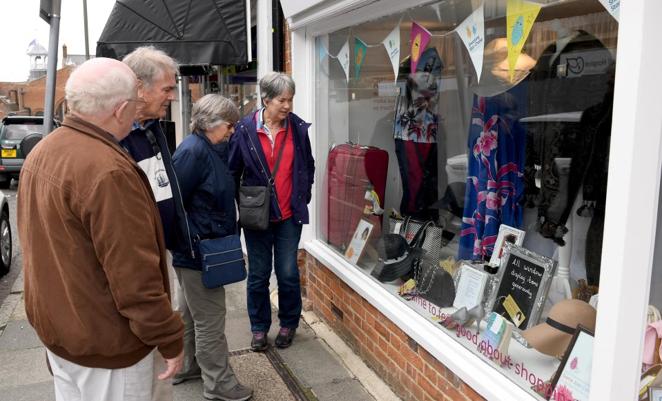 Joan Collins donates clothes to Shooting Star Chase charity shop