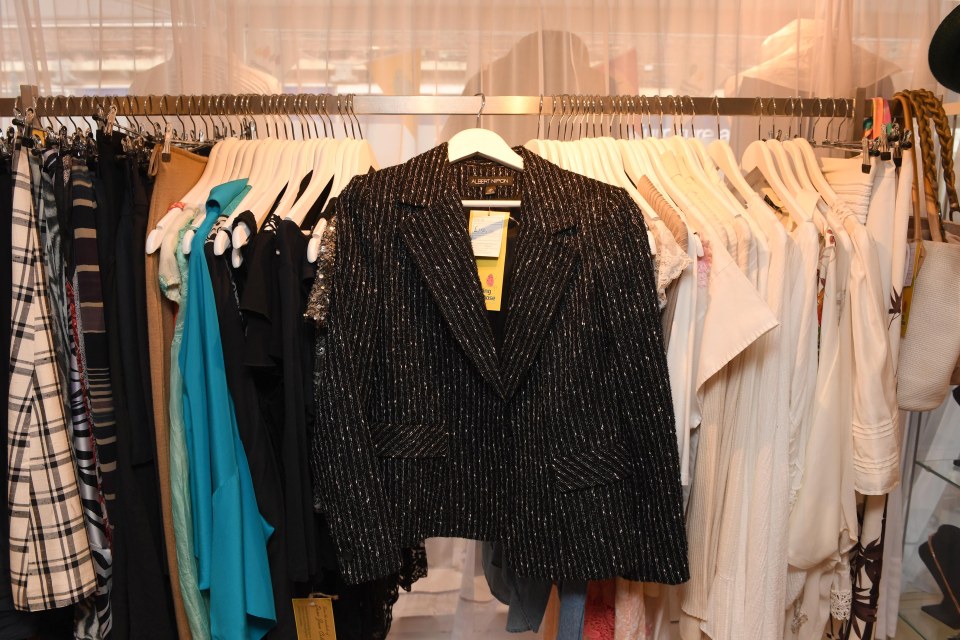 Joan Collins donates clothes to Shooting Star Chase charity shop