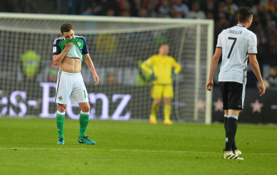 Northern Ireland's Corry Evans reacts after Draxler's goal