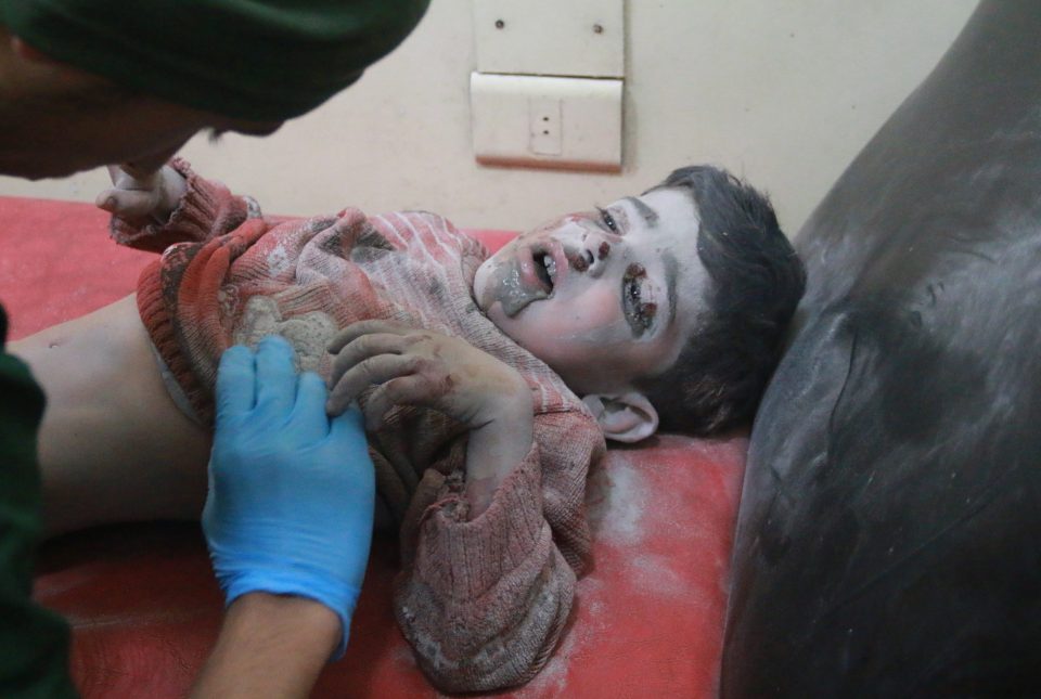 A boy pulled from the rubble is treated at a hospital in Aleppo