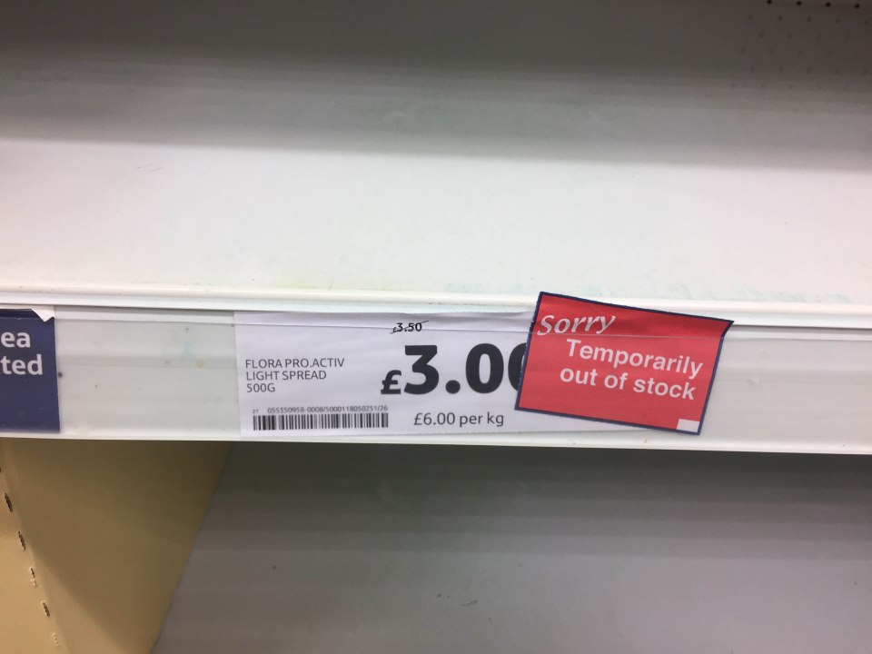 Signs telling customers that products like Flora are temporarily out of stock have been put out in Tesco stores
