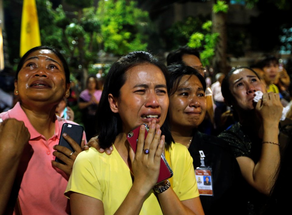 Well-wishers weep outside Thailand's King Bhumibol Adulyadej at the Siriraj hospital where he is residing in Bangkok