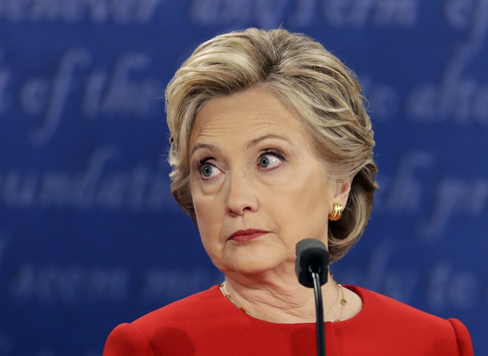Democratic presidential nominee Hillary Clinton listens to Trump 