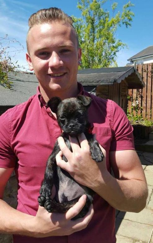 Dog lover . . . Corrie cuddles pooch Louell