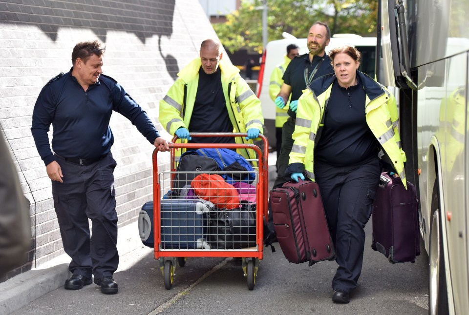 Belongings of the migrant children are offloaded at the Home Office building in Croydon