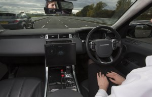 Nail-biting pics show Jaguar Land Rover engineer with no hands on wheel testing self-driving car