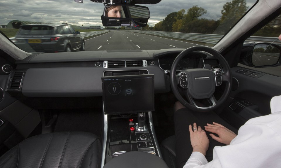 A research engineer demonstrates the car's ‘advanced highway assist’ function