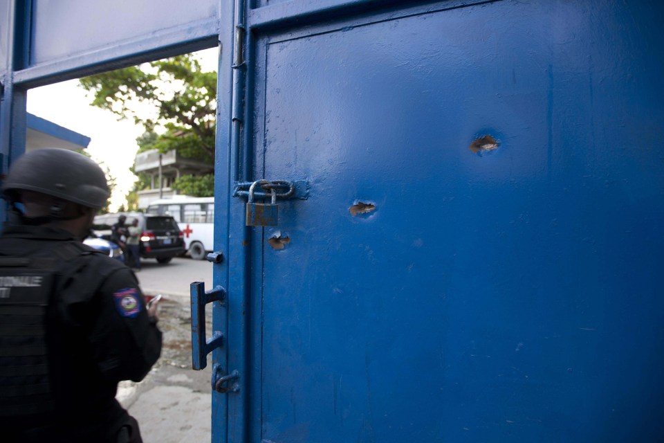 Bullet holes can be seen in the main gate after the prisoners, mostly barefoot, escaped