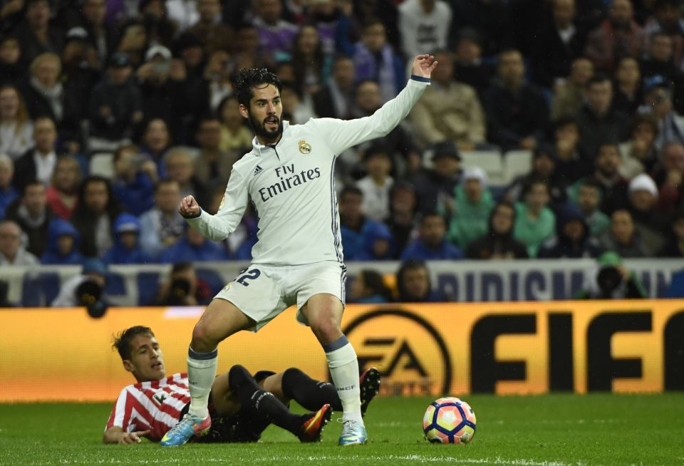 Real Madrid's midfielder Isco (top) vies with Athletic Bilbao's French defender Aymeric Laporte during the Spanish league football match between Real Madrid CF and Athletic Club Bilbao at the Santiago Bernabeu stadium in Madrid on October 23, 2016. / AFP PHOTO / CURTO DE LA TORRECURTO DE LA TORRE/AFP/Getty Images