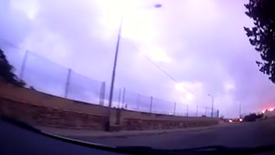 The plane is seen breaking out into flames