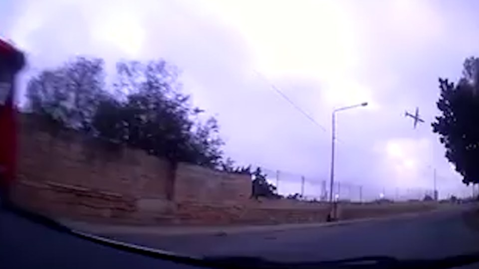 Dashcam footage shows the plane flying above the airport