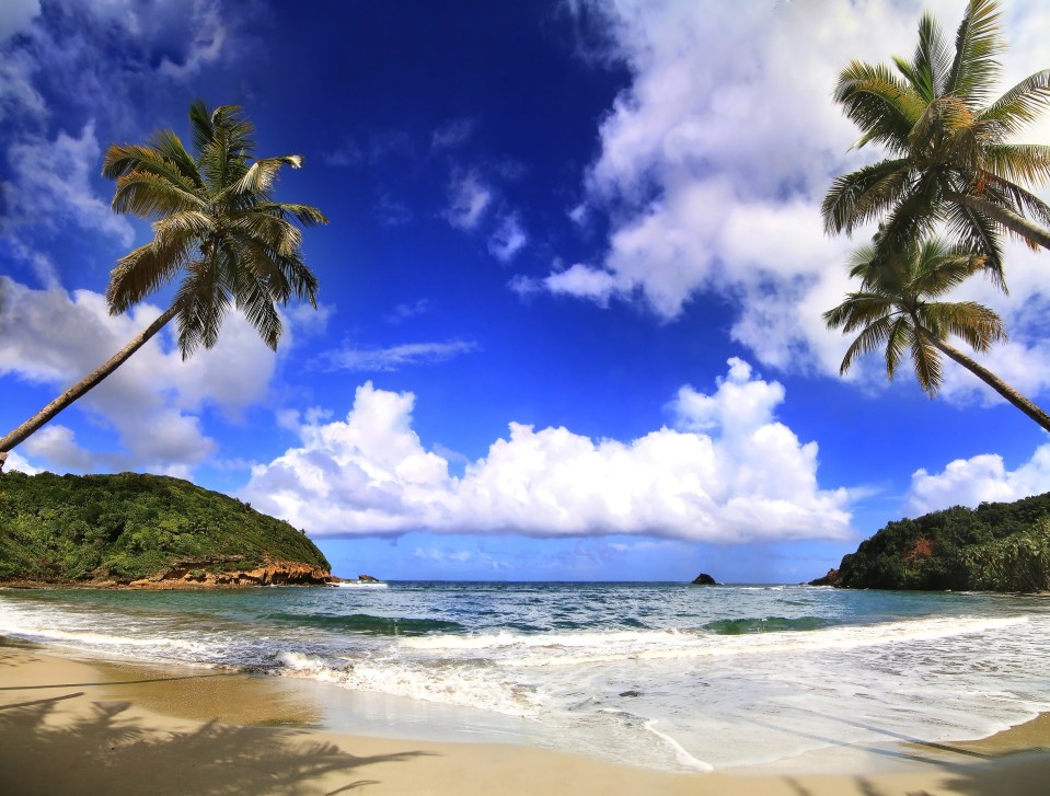 Spot the difference...Wales is beautiful but Dominica, above, has the edge on sunshine