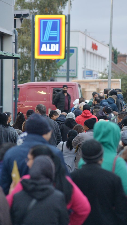 Crowds of people queued outside the store to be some of the first in as it opened its doors