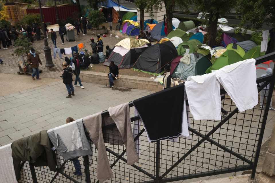 Clothes hang to dry in a street of Paris