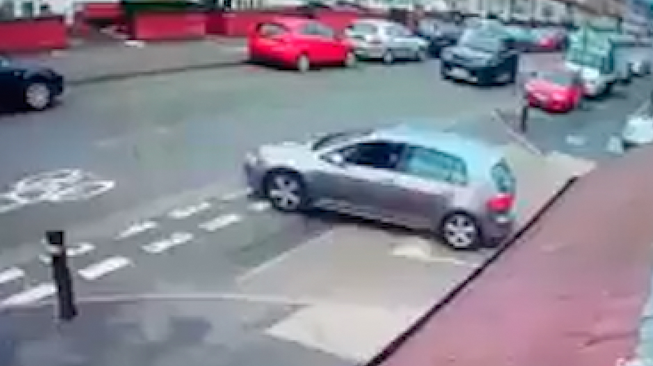 The silver car can be seen pulling onto the street before the fight