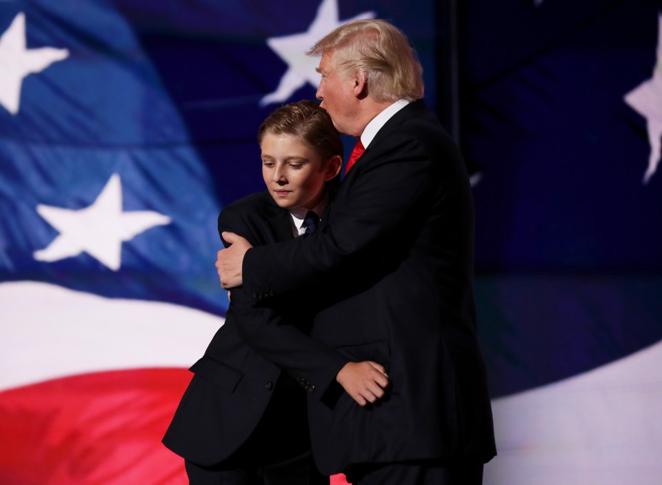 CLEVELAND, OH - JULY 21: Republican presidential candidate Donald embraces his son Barron Trump after he delivered his speech on the fourth day of the Republican National Convention on July 21, 2016 at the Quicken Loans Arena in Cleveland, Ohio. Republican presidential candidate Donald Trump received the number of votes needed to secure the party's nomination. An estimated 50,000 people are expected in Cleveland, including hundreds of protesters and members of the media. The four-day Republican National Convention kicked off on July 18. (Photo by Chip Somodevilla/Getty Images)