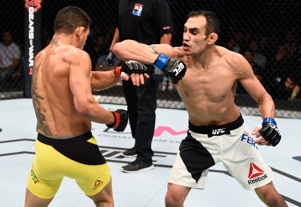 MEXICO CITY, MEXICO - NOVEMBER 05: (R-L) Tony Ferguson of the United States punches Rafael Dos Anjos of Brazil in their lightweight bout during the UFC Fight Night event at Arena Ciudad de Mexico on November 5, 2016 in Mexico City, Mexico. (Photo by Jeff Bottari/Zuffa LLC/Zuffa LLC via Getty Images)