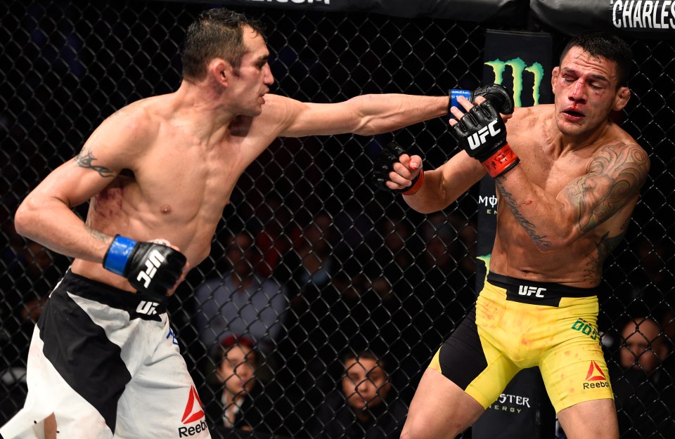 MEXICO CITY, MEXICO - NOVEMBER 05: (L-R) Tony Ferguson of the United States punches Rafael Dos Anjos of Brazil in their lightweight bout during the UFC Fight Night event at Arena Ciudad de Mexico on November 5, 2016 in Mexico City, Mexico. (Photo by Jeff Bottari/Zuffa LLC/Zuffa LLC via Getty Images)
