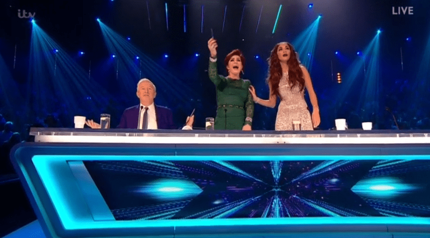Nicole looked horrified as the men ran onto the stage