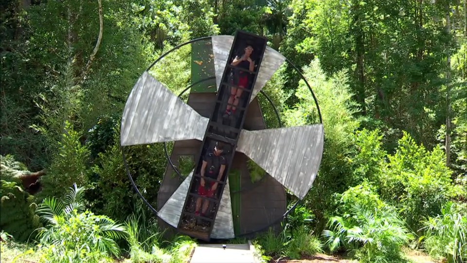 I'm A Celeb camp mates Joel Dommett and Sam Quek are strapped inside this rotating windmill