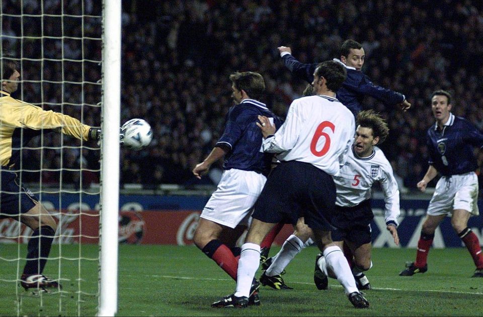 Scotland's Don Hutchinson rises above the England defence to head home in a Euro 2000 qualifier