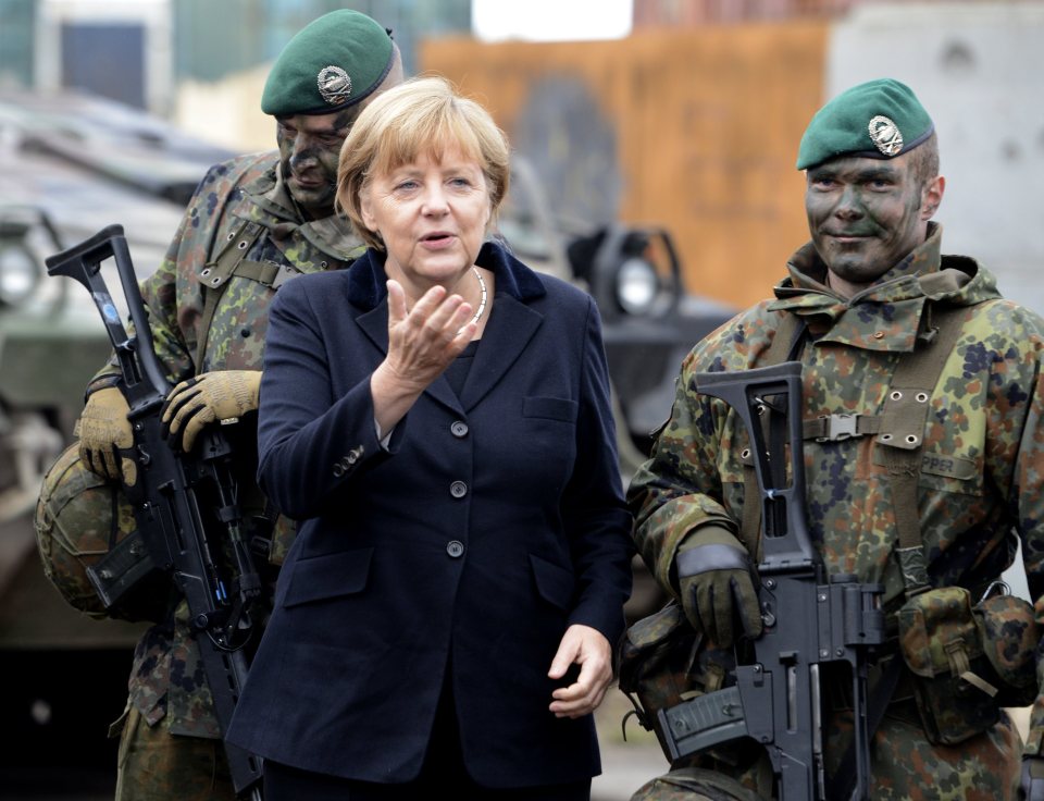 German Chancellor Angela Merkel poses with German soldiers 