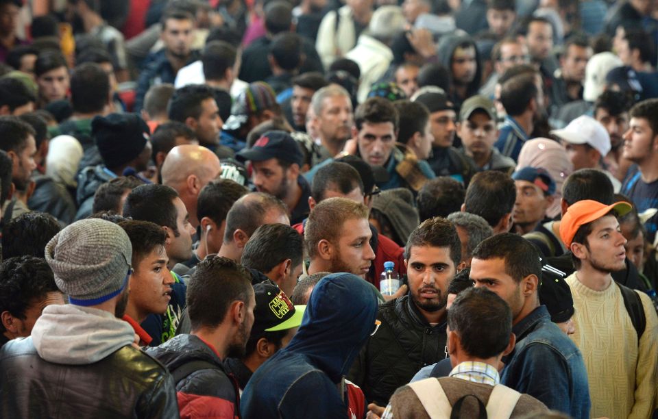 Migrants, mostly young men, waiting for a special train at the railway station in Freilassing, near the Austrian-German border, southern Germany, after changing from an express train coming from Hungary and Austria
