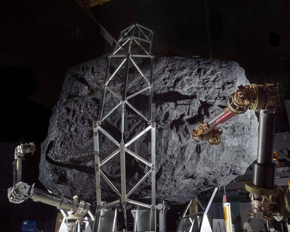 A prototype of the Asteroid Redirect Mission (ARM) robotic capture module system is being tested with a mock asteroid boulder in its clutches at NASAs Goddard Space Flight Center