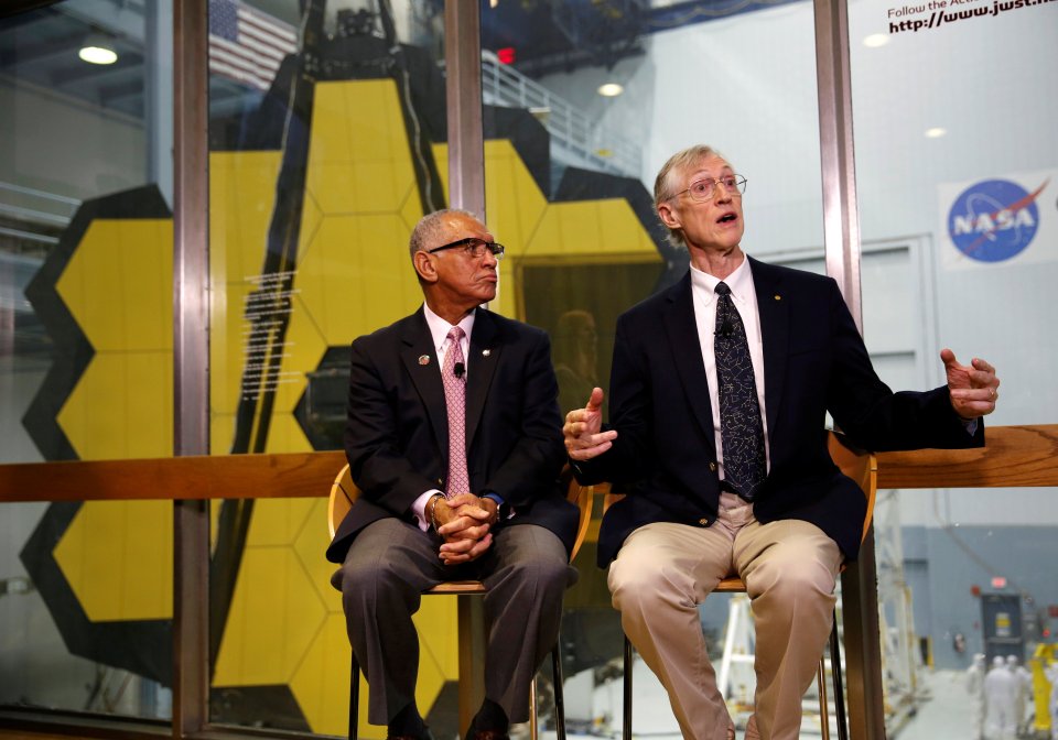 NASA Administrator Charles Bolden (L) listens to Senior Astrophysicist Dr. John Mather 