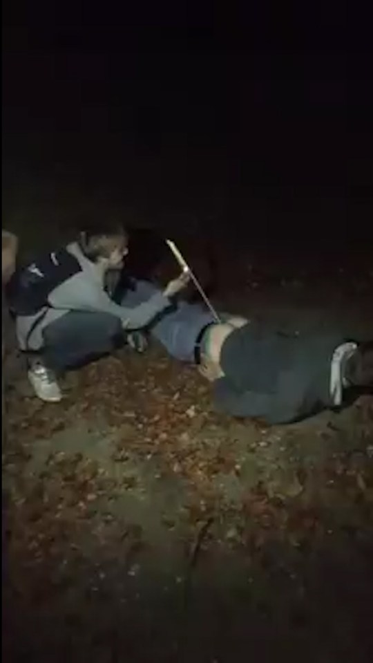This is the moment a bloke has a firework set off from his backside