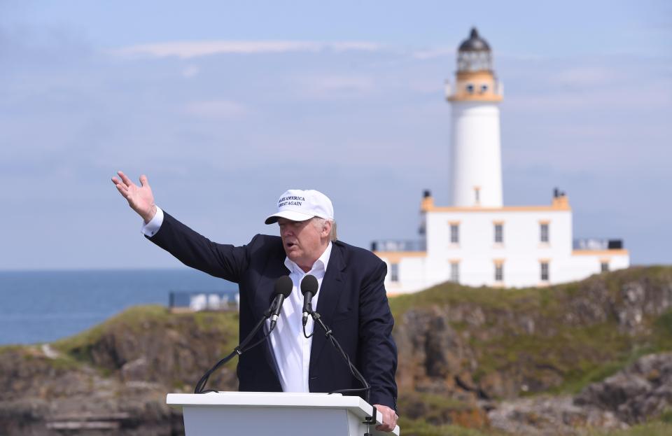 Republican presidential candidate Donald Trump speaks in front of the lighthouse, at his Turnberry golf course