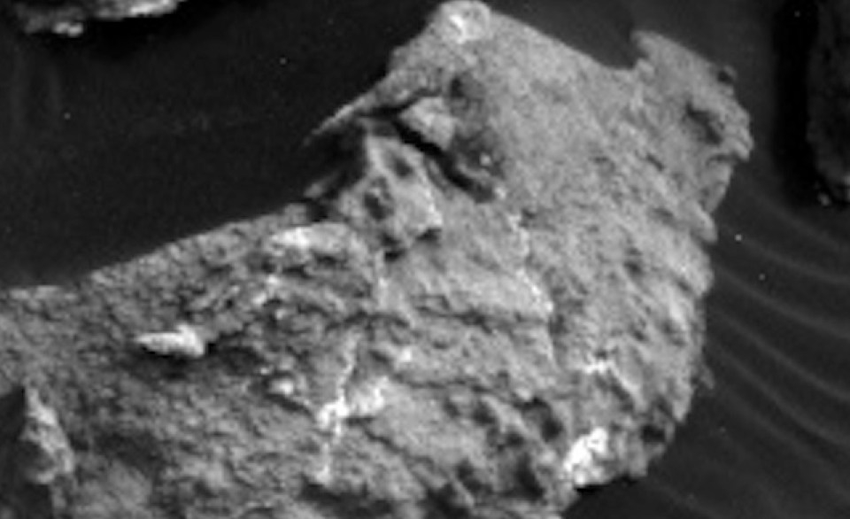 This photo allegedly shows a carving of a woman's body on the surface of Mars