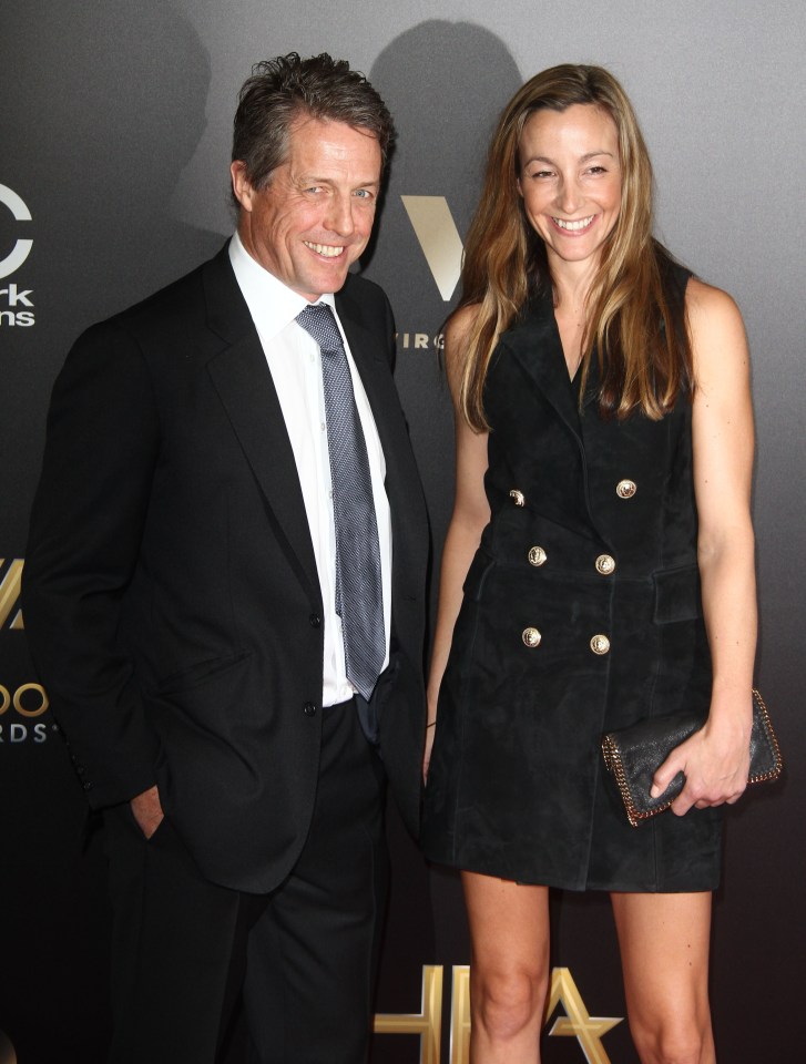 Hugh Grant and Anna Elisabet Eberstein have a laugh on the red carpet