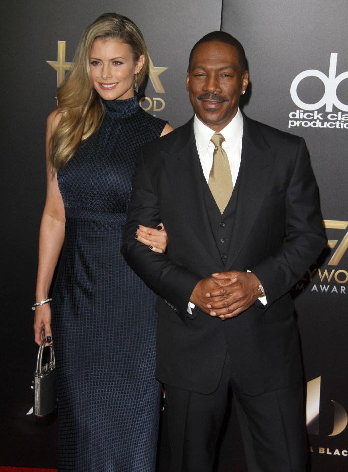 Eddie Murphy and Paige Butcher strike a pose on the red carpet
