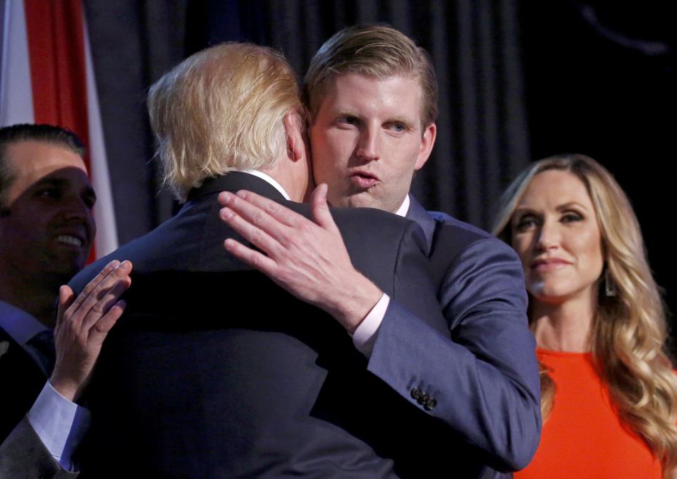 Donald Trump (L) embraces his son Eric Trump 