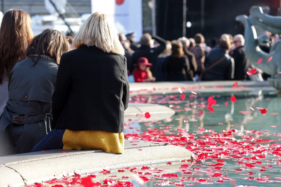 FAMEFLYNET - Members Of The Public Gather In Trafalgar Square For A Remembrance Event