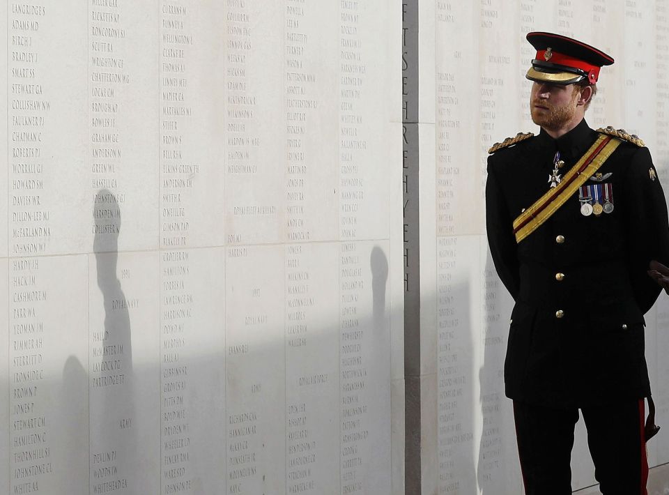 Britain's Prince Harry looks at the name