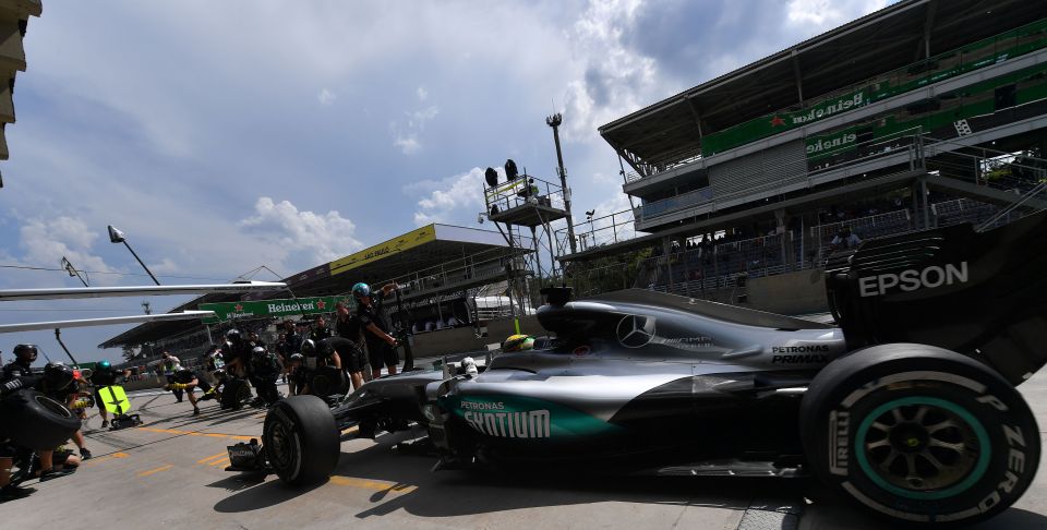 Jenson Button says Lewis Hamilton will fare better than Nico Rosberg in the rain